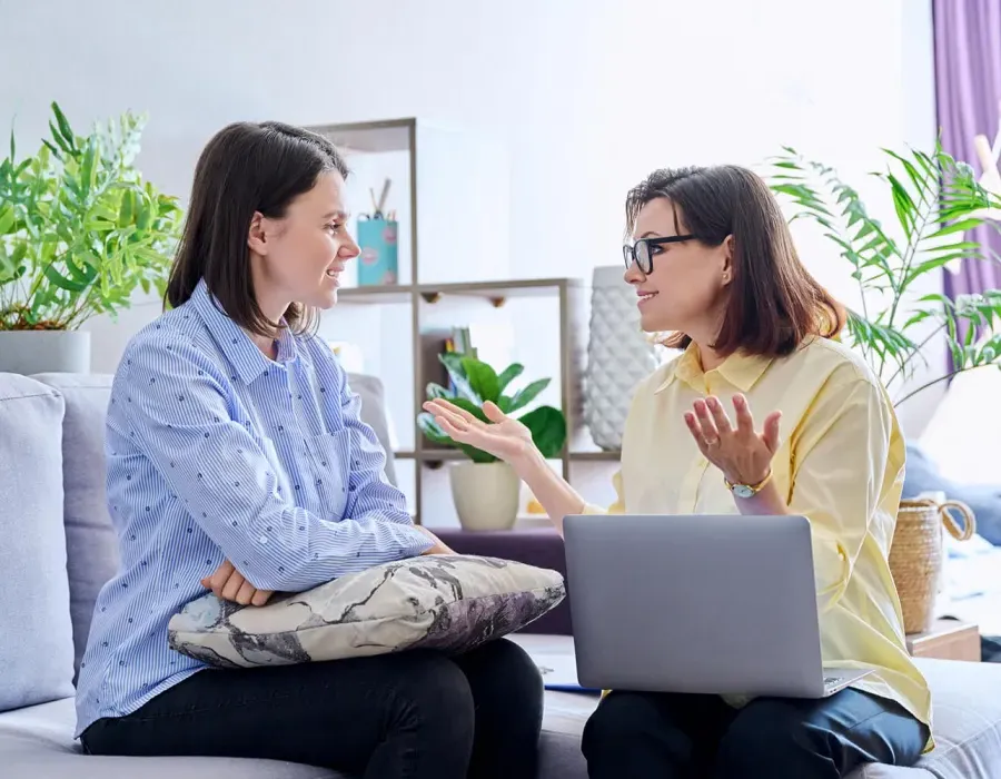 Psychologist with Laptop Speaking with Patient